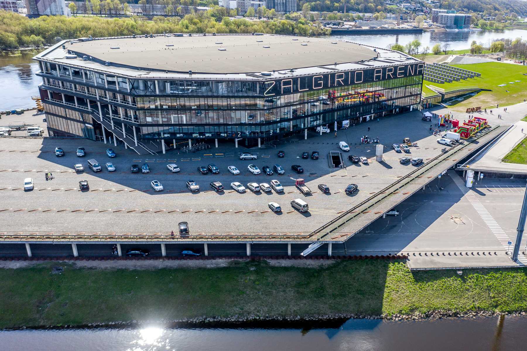 Modern Žalgiris Arena building beside the river in Kaunas